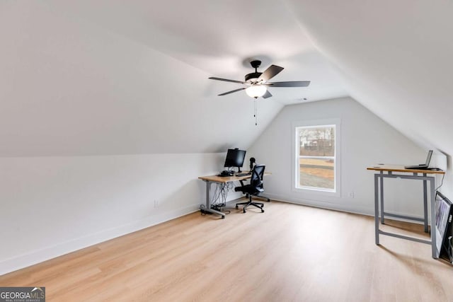 office with ceiling fan, light hardwood / wood-style flooring, and vaulted ceiling