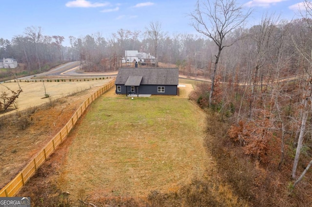 view of yard with a rural view and an outdoor structure