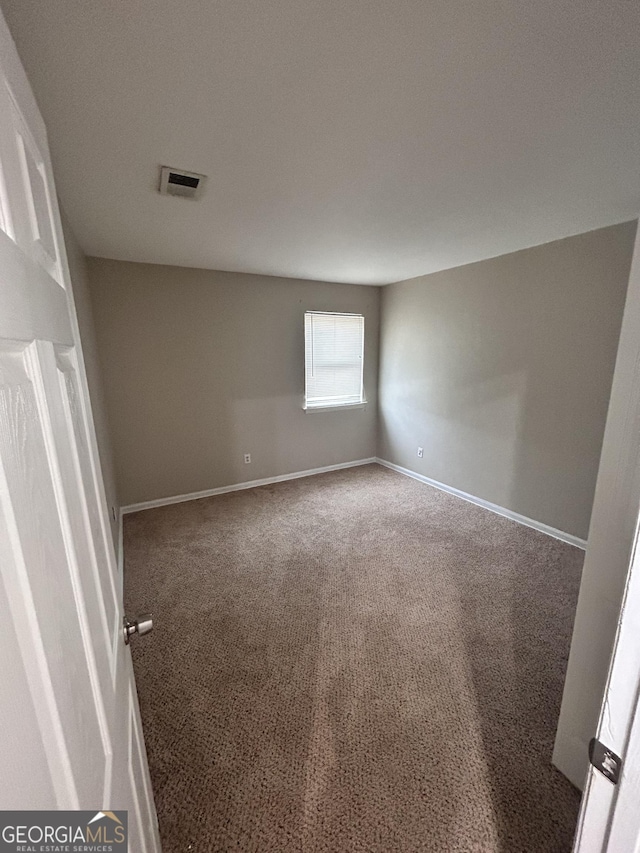 unfurnished room featuring carpet floors