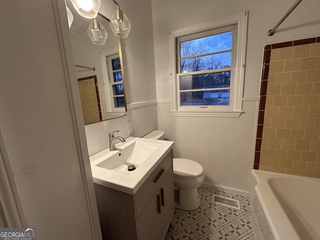 full bathroom with tile patterned floors, vanity, toilet, and tiled shower / bath