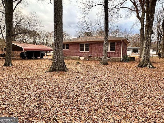 view of home's exterior with a carport