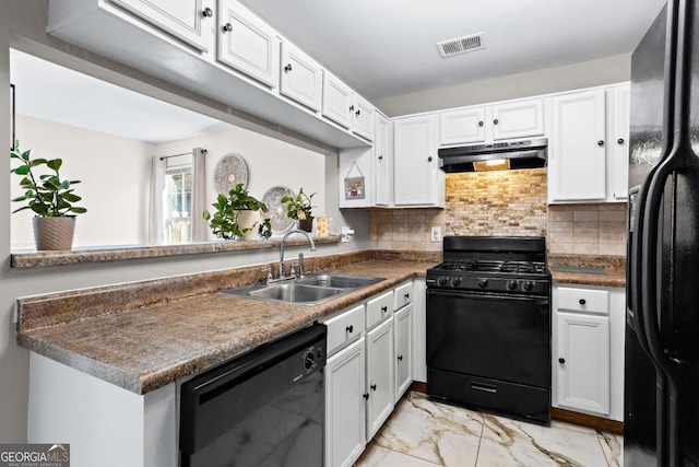 kitchen featuring kitchen peninsula, tasteful backsplash, sink, black appliances, and white cabinetry