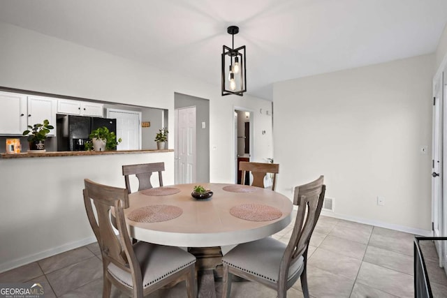 dining room featuring light tile patterned floors