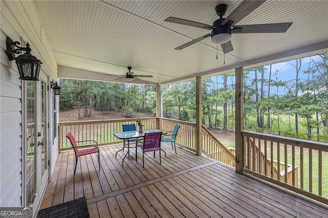 wooden terrace featuring ceiling fan