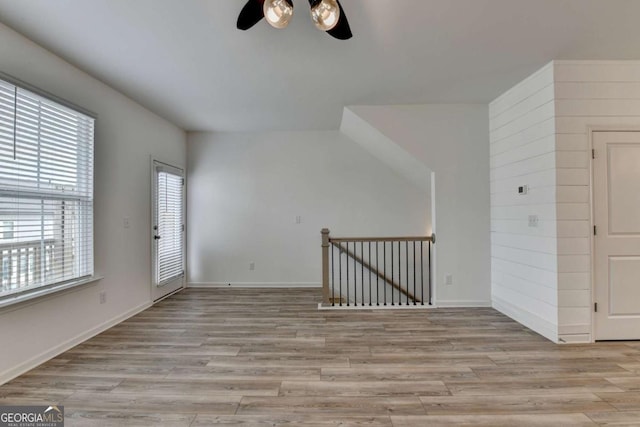 spare room with ceiling fan and light hardwood / wood-style floors