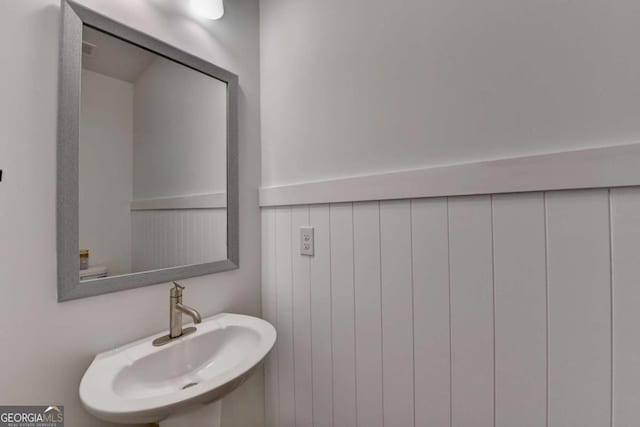 bathroom featuring sink and toilet