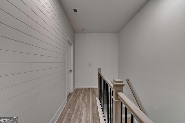 corridor with light wood-type flooring