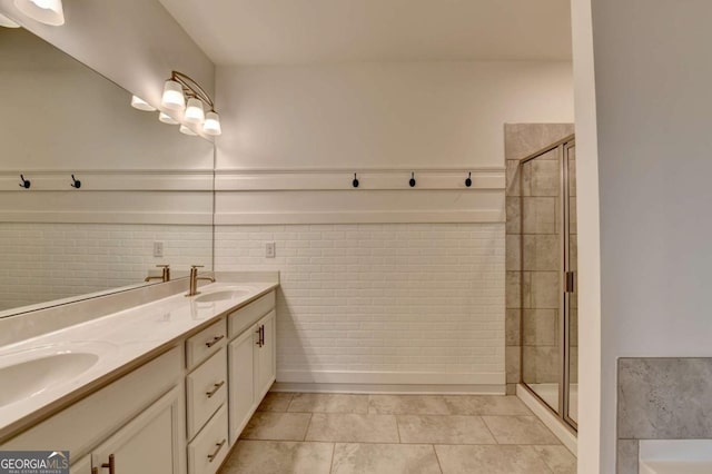 bathroom with tile patterned flooring, vanity, and an enclosed shower