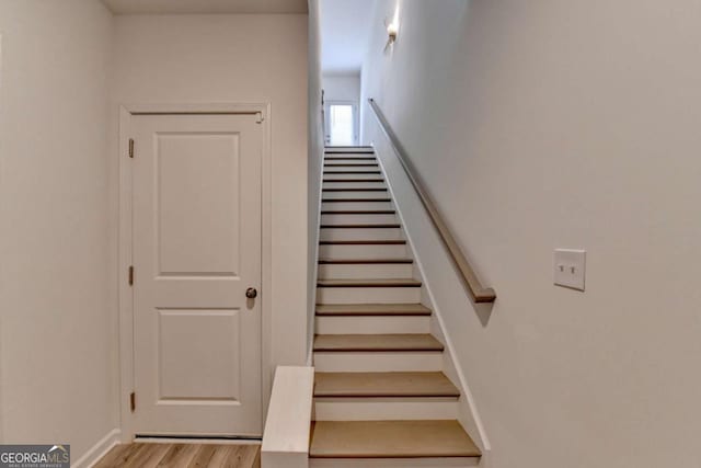 staircase featuring hardwood / wood-style flooring