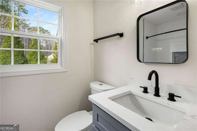 bathroom with vanity and toilet