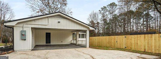 back of house with a carport