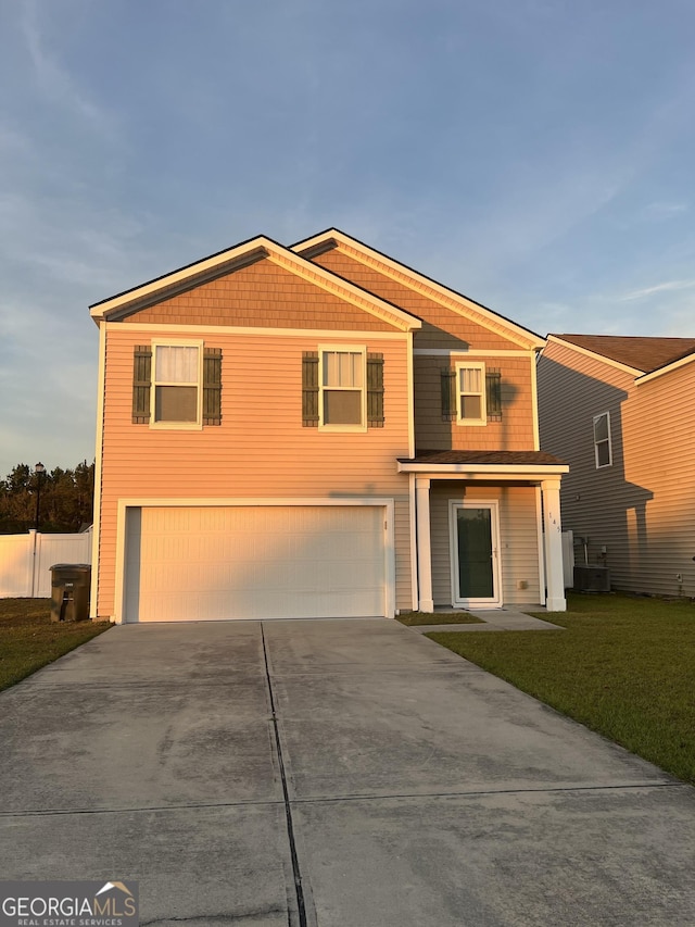 view of front of home with cooling unit, a garage, and a front lawn