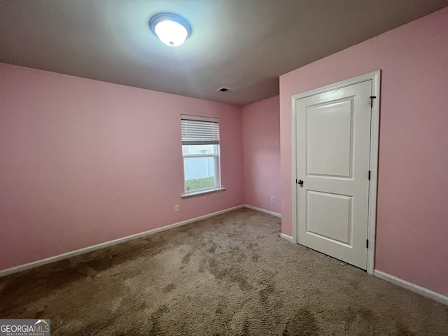 view of carpeted spare room