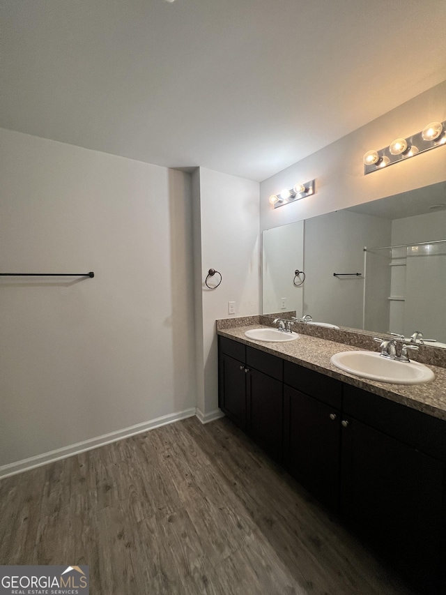 bathroom with vanity and hardwood / wood-style flooring