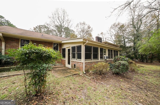 rear view of house with a patio