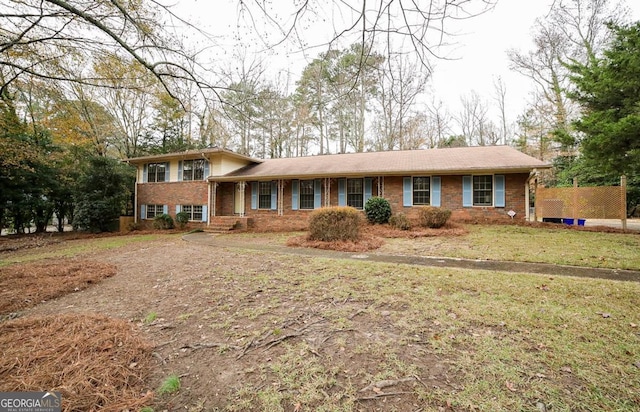 tri-level home with a front yard