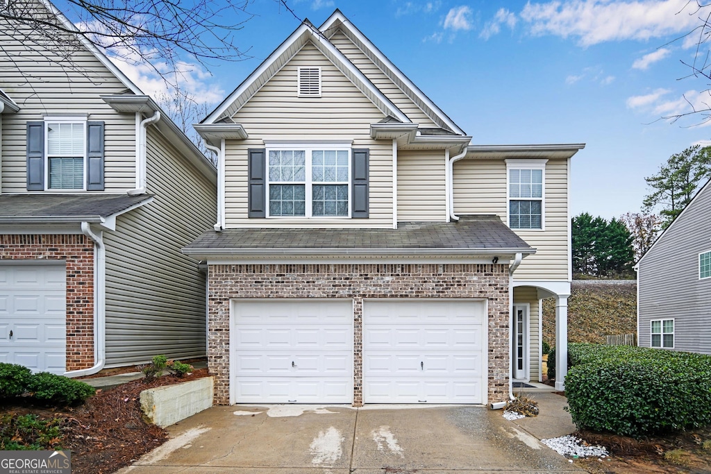 front of property with a garage