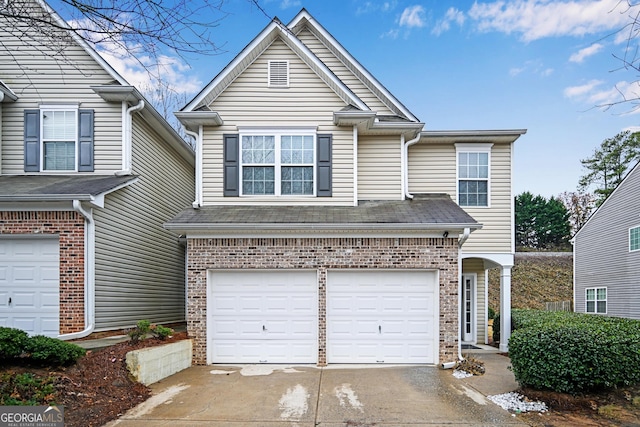 front of property with a garage