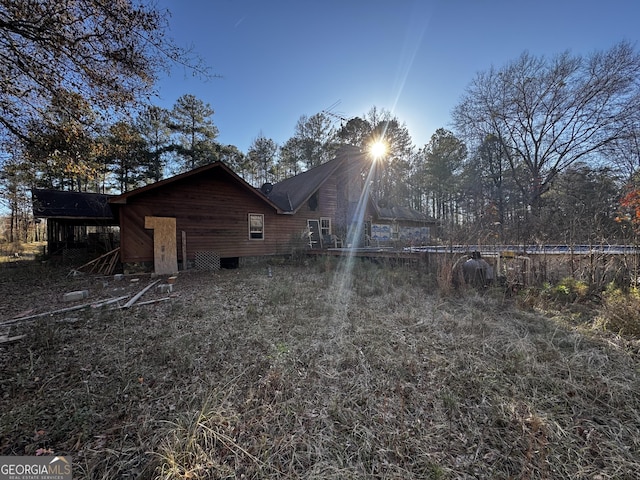 view of back house at dusk