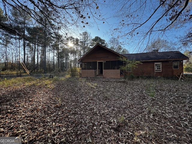 rear view of house with a sunroom