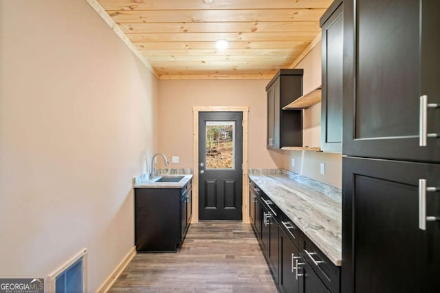 bar with refrigerator, light stone counters, wood-type flooring, and wooden ceiling