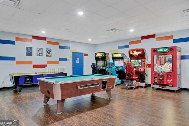 rec room with a drop ceiling, dark wood-type flooring, and billiards