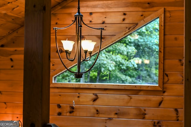 details featuring wood walls and wood ceiling