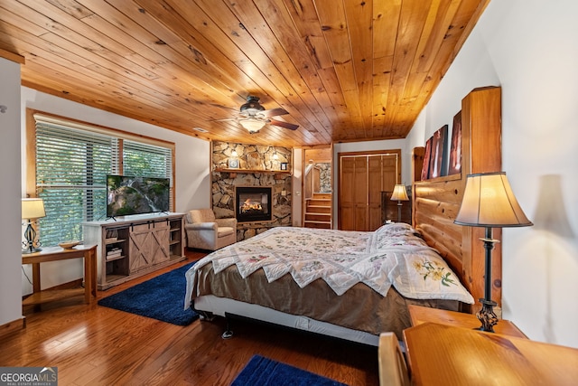 bedroom with wooden ceiling, vaulted ceiling, dark hardwood / wood-style floors, ceiling fan, and a closet