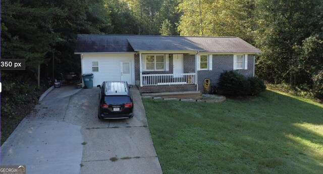 ranch-style house with a porch and a front lawn