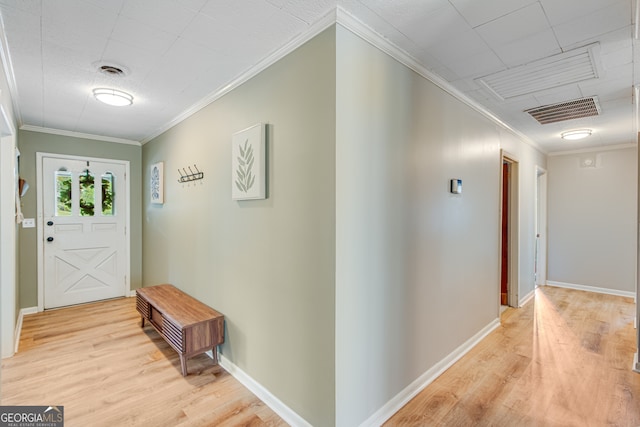 interior space featuring light hardwood / wood-style floors and ornamental molding