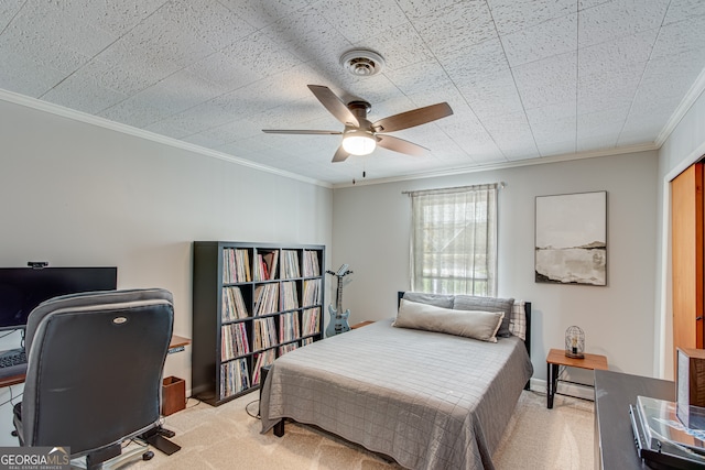 carpeted bedroom featuring ceiling fan and ornamental molding