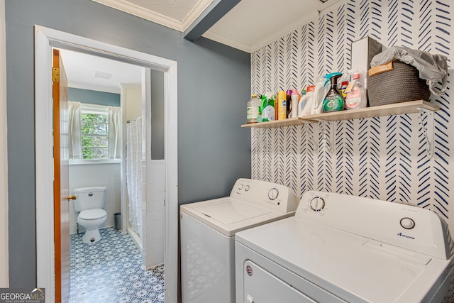 washroom with separate washer and dryer, crown molding, and tile walls