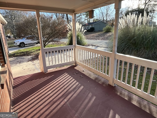 wooden deck featuring covered porch