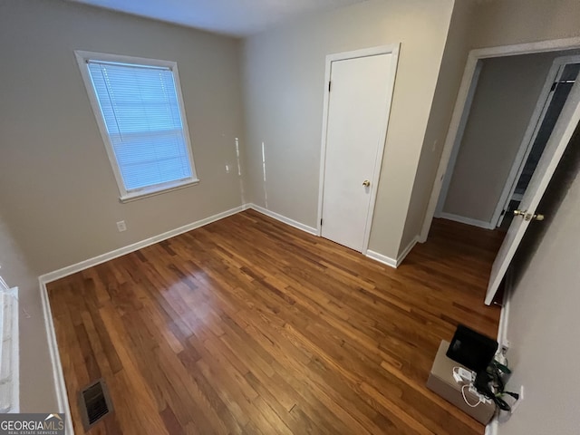 unfurnished bedroom featuring wood-type flooring