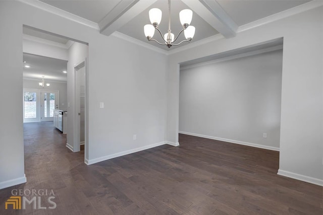 empty room featuring ornamental molding, dark wood-type flooring, a chandelier, and beam ceiling
