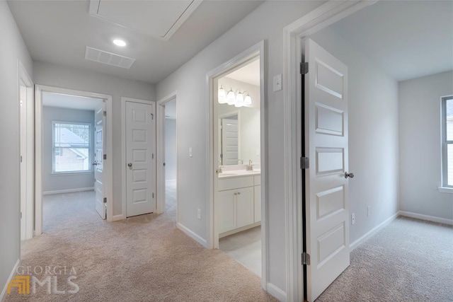 hallway with light carpet