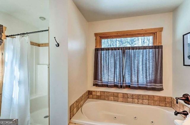 bathroom with separate shower and tub