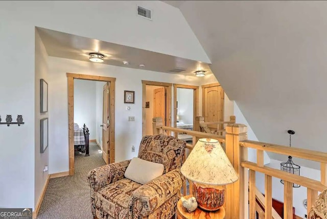 living room with carpet floors and vaulted ceiling