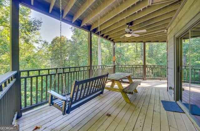 wooden deck featuring ceiling fan