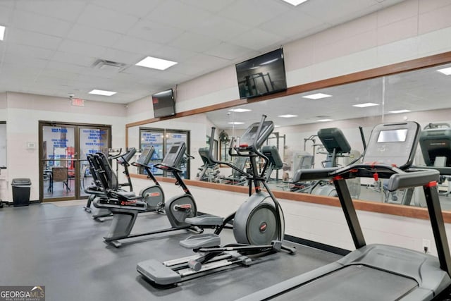 gym featuring a drop ceiling