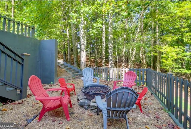 view of patio with a fire pit