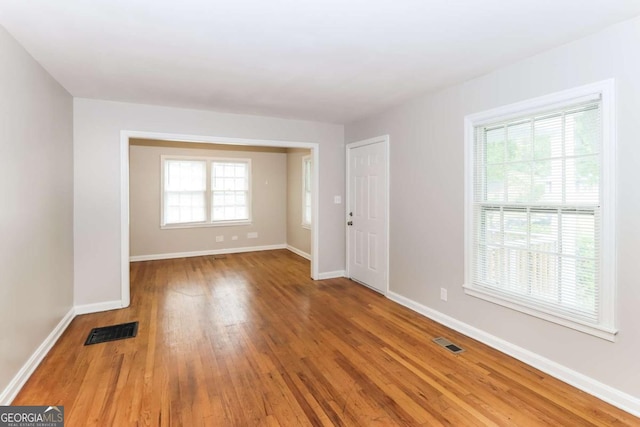 unfurnished room featuring hardwood / wood-style floors