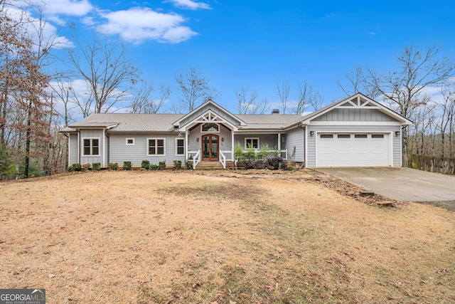 single story home featuring french doors and a garage