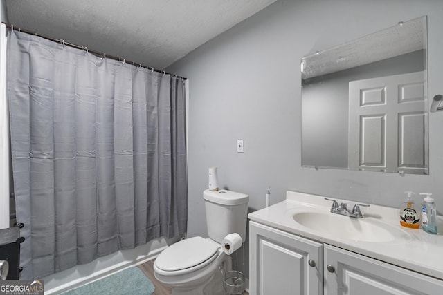 full bathroom featuring vanity, toilet, a textured ceiling, and shower / tub combo with curtain