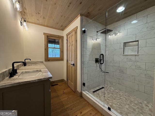 bathroom featuring vanity, wood-type flooring, wooden ceiling, and walk in shower