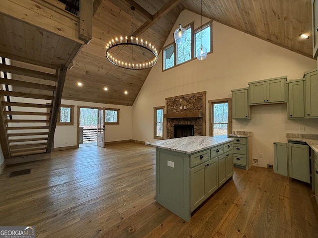 kitchen featuring high vaulted ceiling, dark hardwood / wood-style flooring, and green cabinetry