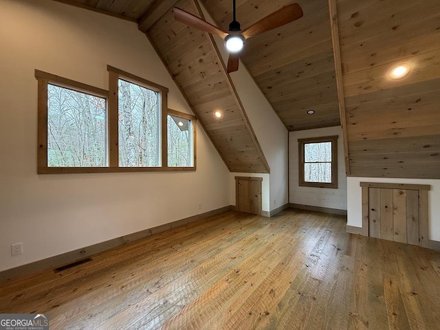 bonus room with wood ceiling, light hardwood / wood-style flooring, lofted ceiling with beams, and ceiling fan