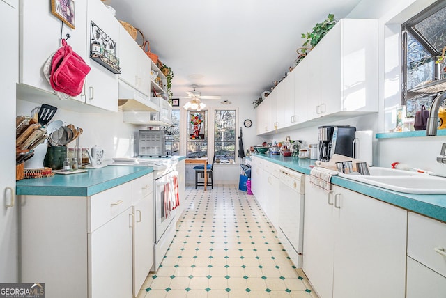 kitchen with ceiling fan, white cabinetry, sink, white dishwasher, and range