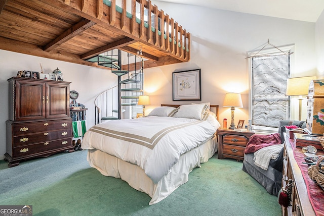 carpeted bedroom with beamed ceiling and wooden ceiling