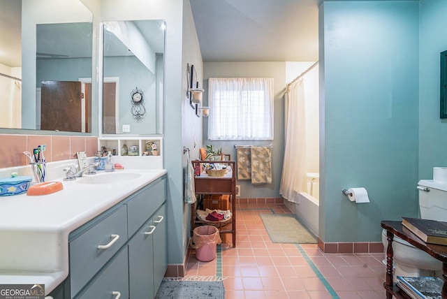 bathroom with shower / bathtub combination with curtain, tile patterned flooring, and vanity